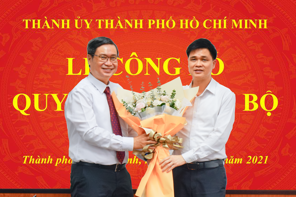 Ông Ngọ Duy Hiểu, Phó Chủ tịch Tổng Liên đoàn Lao động Việt Nam tặng hoa chúc mừng PGS. TS. Vương Đức Hoàng Quân tại lễ công bố quyết định cán bộ.