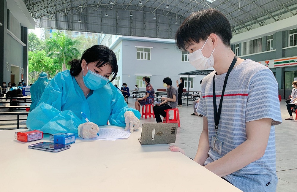 Students being screened before the vaccination.