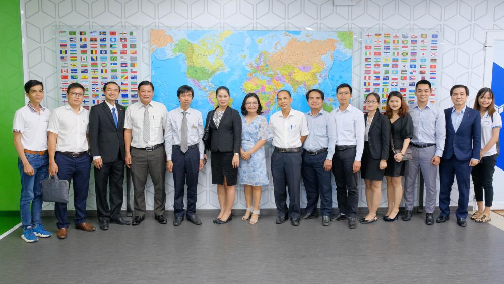 Business representatives taking photos with the Board of Organisers