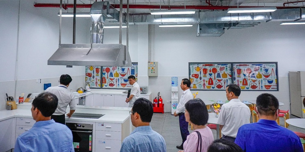 The delegation taking a tour of Tan Phong campus.